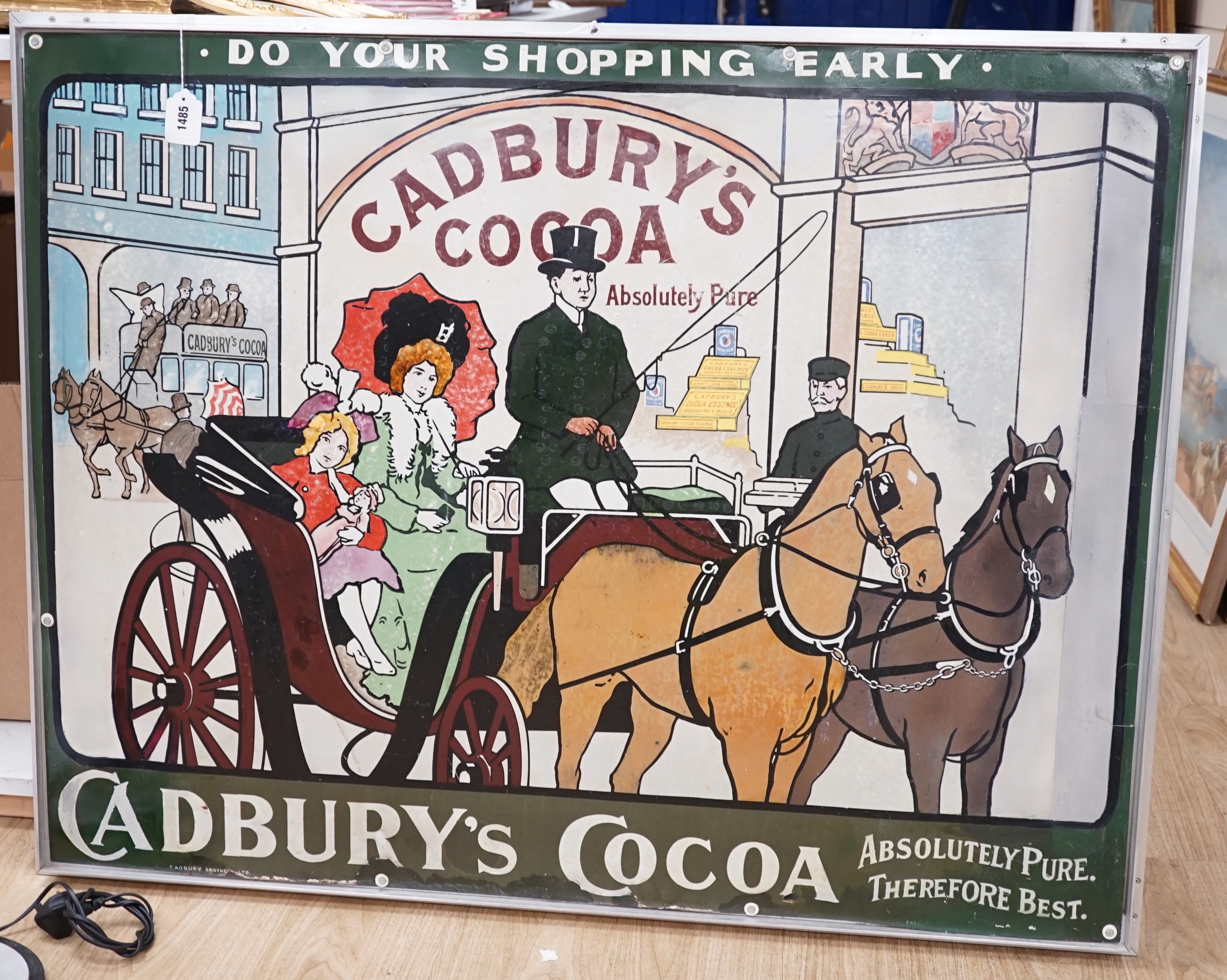 A Cadbury's Cocoa “Do Your Shopping Early” pictorial enamelled advertising sign. Formerly part of Andrew Morley’s enamel sign exhibition “So Near Yet So Far” 118 x 92cm, later aluminium frame.